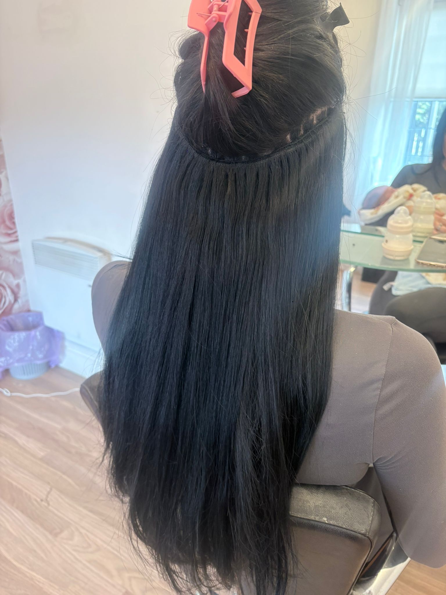 Hair extension fitting in progress