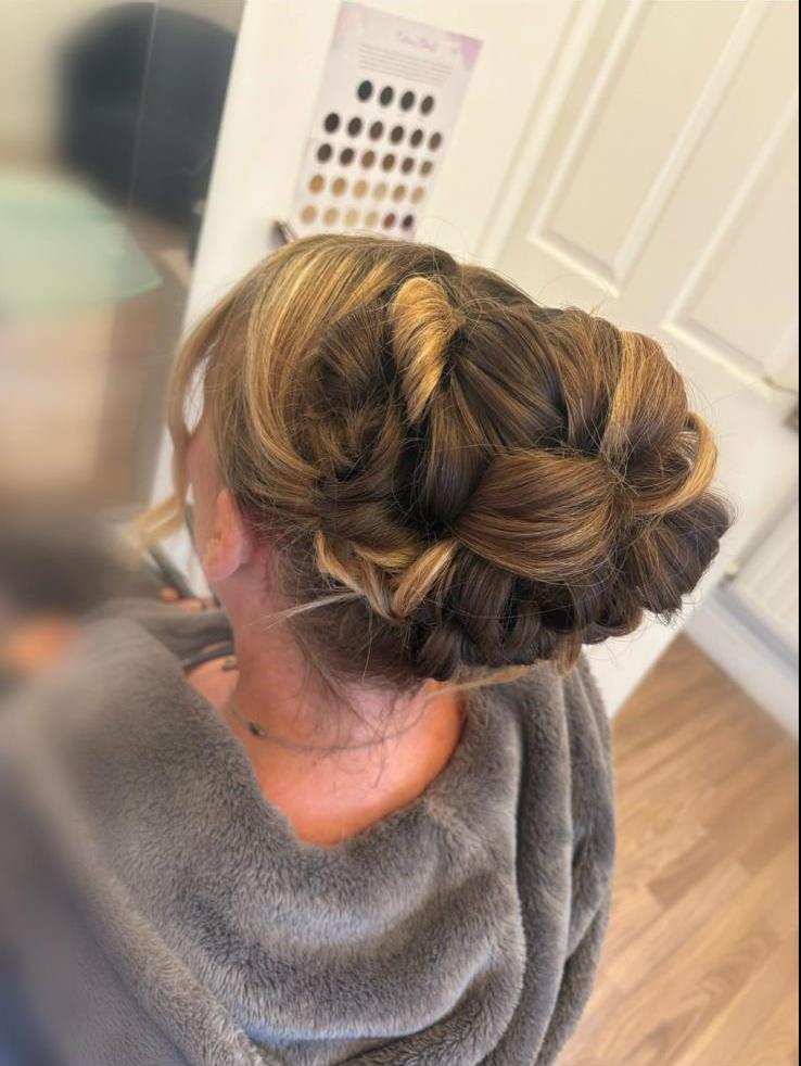 Elegant updo styled with extensions